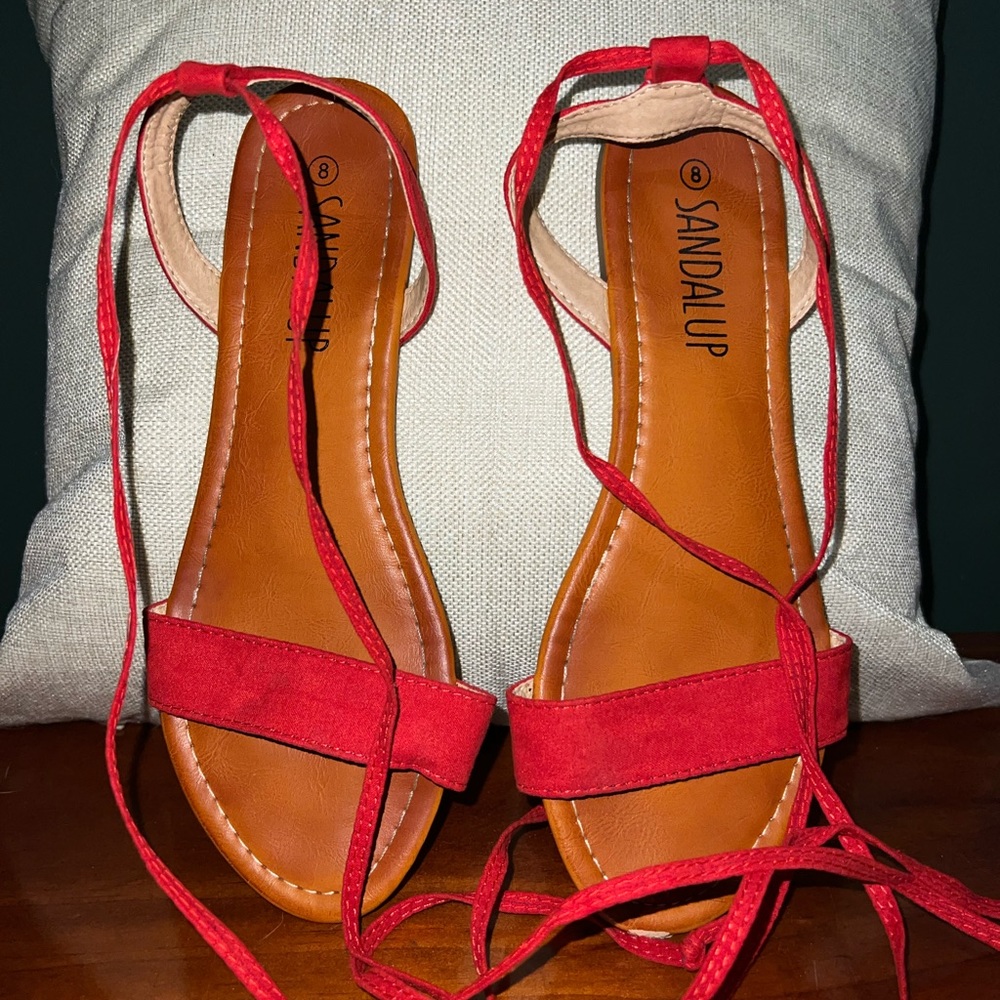 Red tie around sandals